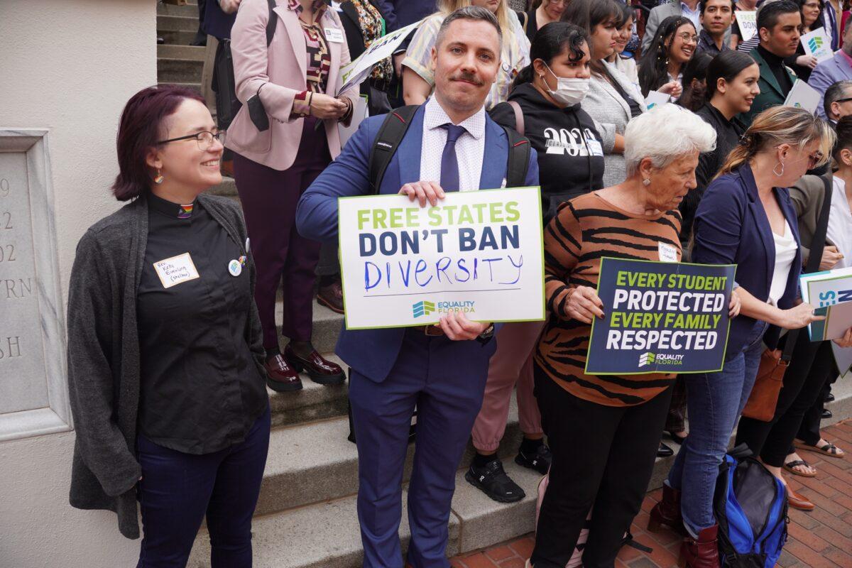  A demonstrator at the Equality Florida rally at the state Capitol in Tallahassee holds a sign that says "Free States Don't Ban Diversity" on March 13, 2023. (Dan M. Berger/The Epoch Times)