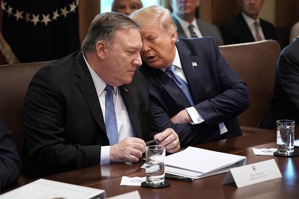 U.S. President Donald Trump (R) talks with Secretary of State Mike Pompeo during a cabinet meeting at the White House July 16, 2019. Trump and members of his administration addressed a wide variety of subjects, including Iran, for more than an hour. (Chip Somodevilla/Getty Images)