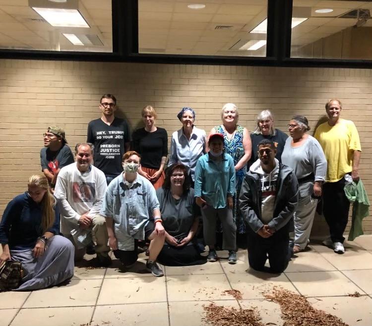 The nine pro-life activists arrested at the Washington Surgi-Clinic pose with friends after their release from jail in Washington on Oct. 22, 2020. In the back row, they are: (From L) Emiliano Andrews, Jonathan Darnel, an unidentified Operation Save America protester, Jean Marshall, Paulette Harlow, Joan Andrews, Heather Idoni, and John Hinshaw. In the front row are: (From L) an unidentified Operation Save America protester, Will Goodman, Herb Geraghty, Lauren Handy, the daughter Paulette Harlow, and Jay Smith. (Courtesy of Terrisa Bukovinac)