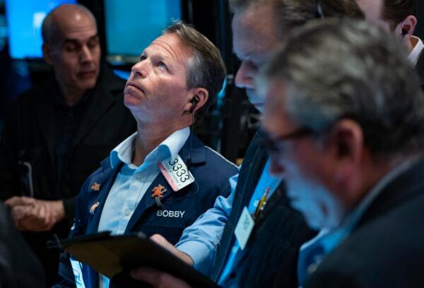 Traders work on the floor at the New York Stock Exchange in New York on March 13, 2023. (Craig Ruttle/AP Photo)