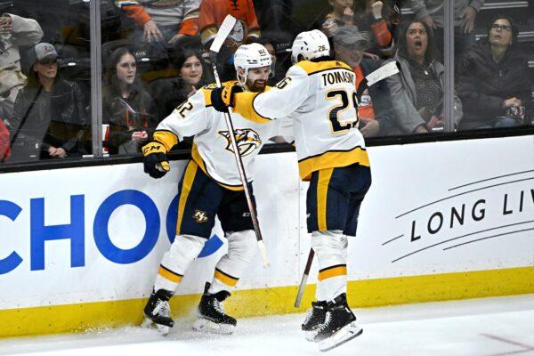 Nashville Predators center Philip Tomasino (R), leaps into center Tommy Novak after Novak scores the game-winning goal against the Anaheim Ducks during the overtime period of an NHL hockey game in Anaheim, Calif., on March 12, 2023. (Alex Gallardo/AP Photo)