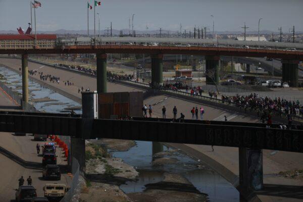 Migrants, mostly of Venezuelan origin, attempt to forcibly cross into the United States at the Paso del Norte International Bridge in Ciudad Juarez, Chihuahua, Mexico, on March 12, 2023. Hundreds of migrants, mostly Venezuelans, attempted to stampede across one of the border bridges, desperate to enter the United States. (HERIKA MARTINEZ/AFP via Getty Images)