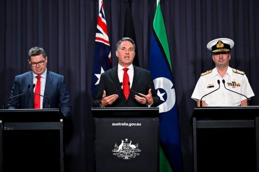(L–R) Australian Defense Industry Minister Pat Conroy, Australian Deputy Prime Minister Richard Marles, and head of the Nuclear Powered Submarine Task Force Vice Adm. Jonathan Mead speak to the media during a press conference at Parliament House in Canberra, Australia, on March 14, 2023. (Lukas Coch/AAP Image via AP)