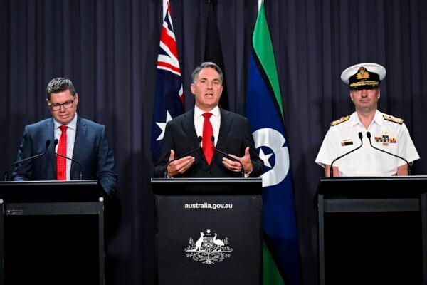 (L–R) Australian Defense Industry Minister Pat Conroy, Australian Deputy Prime Minister Richard Marles, and head of the Nuclear Powered Submarine Task Force Vice Adm. Jonathan Mead speak to the media during a press conference at Parliament House in Canberra, Australia, on March 14, 2023. (Lukas Coch/AAP Image via AP)