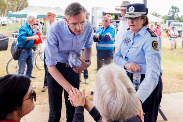NSW Premier Dominic Perrottet greets locals affected by floods on November 18, 2022 in Eugowra, Australia. (Photo by Jenny Evans/Getty Images)