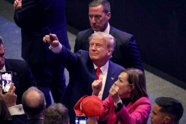 Former President Donald Trump greets guests following an event at the Adler Theatre in Davenport, Iowa, on March 13, 2023. Trump's visit follows those of potential challengers for the GOP presidential nomination, Florida Gov. Ron DeSantis and former U.N. Ambassador Nikki Haley, who hosted events in the state a week earlier. (Scott Olson/Getty Images)