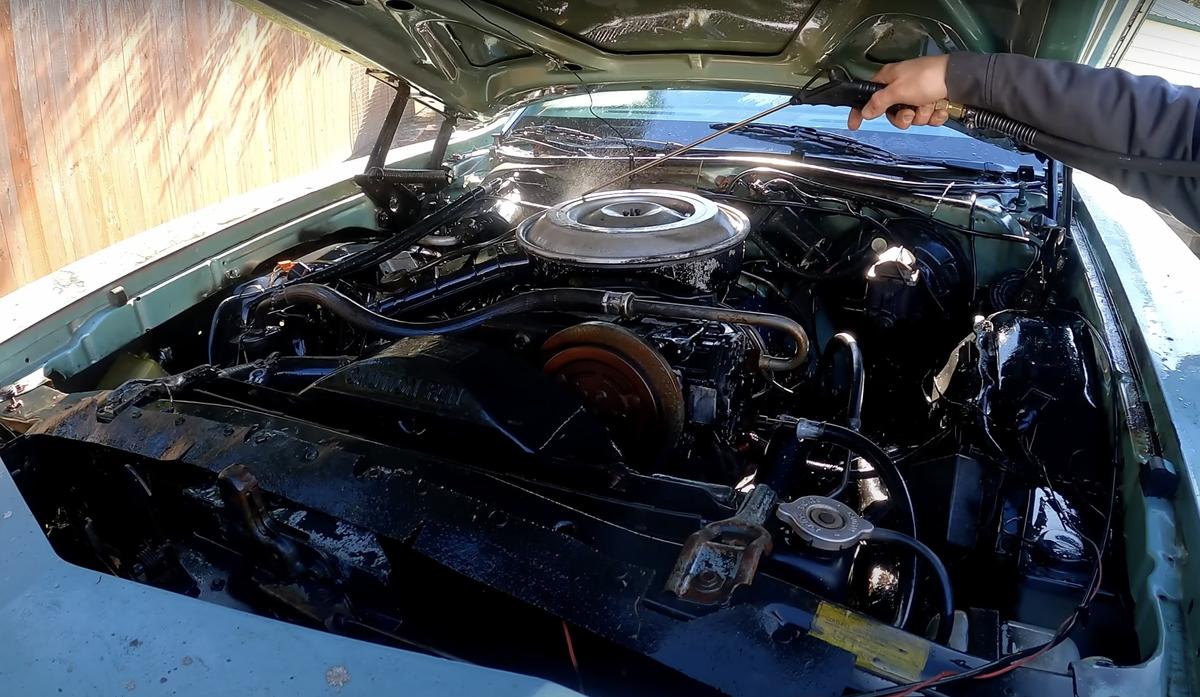 Chris washes the engine and under the hood, after the car had been sitting for 20 years. (Courtesy of <a href="https://www.youtube.com/@NoNonsenseKnowHow?themeRefresh=1">NoNonsenseKnowHow</a>)