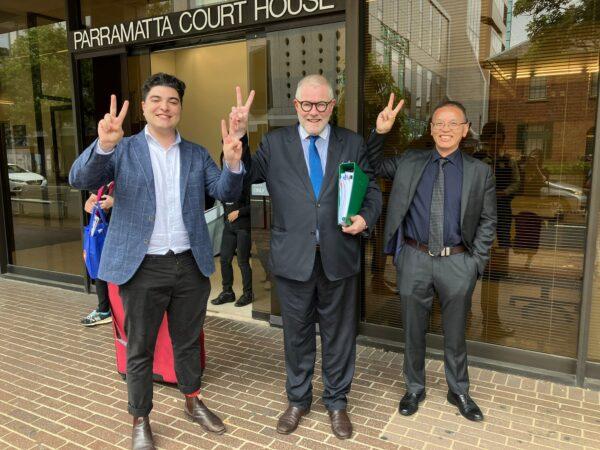 Anti-CCP activist Drew Pavlou, standing his lawyer Tony Morris KC and CCP defector Chen Yonglin, wins his case with NSW Police at a local court in Parramatta, Australia, on March 14, 2023. (Melanie Sun/The Epoch Times)