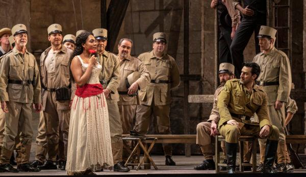 Carmen (mezzo-soprano J’Nai Bridges) and Don Josè (tenor Charles Castronovo, seated R) are tragic lovers in the Lyric Opera’s production of “Carmen.” (Todd Rosenberg)