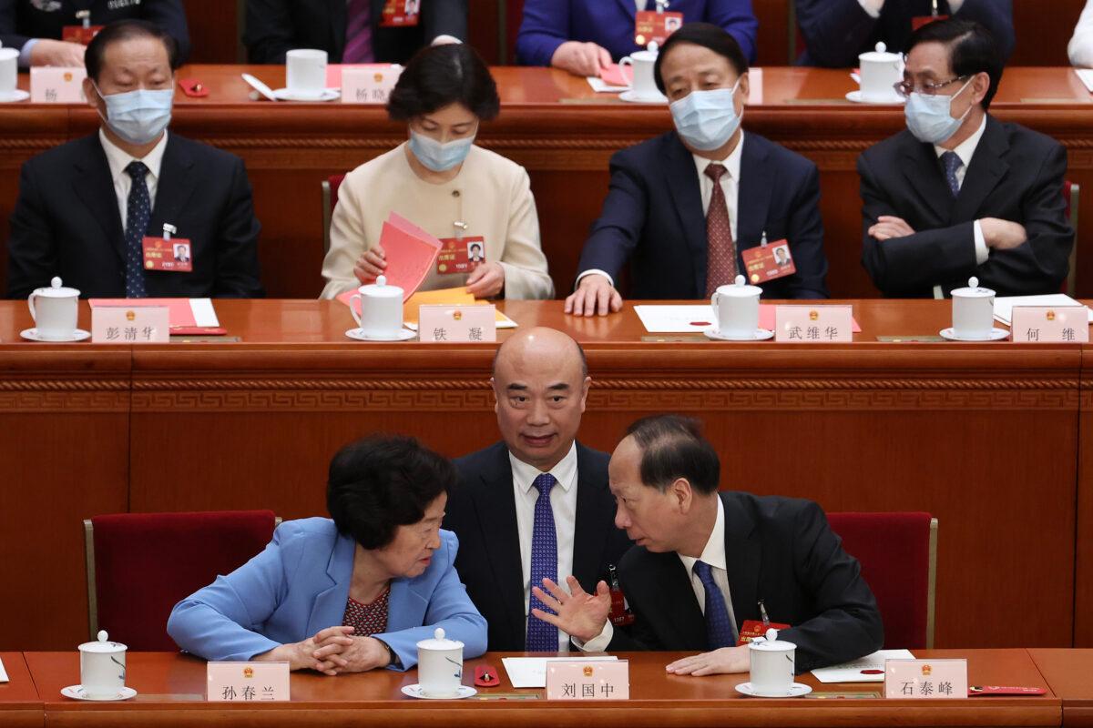 (Fore, L–R) Chinese Vice Premier, Sun Chunlan, Central Committee Political Bureau member Liu Guozhong, and Vice Chairman of the Chinese People's Political Consultative Conference Shi Taifeng attend the fourth plenary session of the National People's Congress in Beijing on March 11, 2023. (Lintao Zhang/Getty Images)