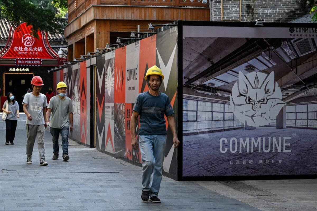 Workers are seen near a restaurant under construction on a commercial street in Foshan, in southern China's Guangdong Province, on Oct. 24, 2022. (Jade Gao/AFP via Getty Images)