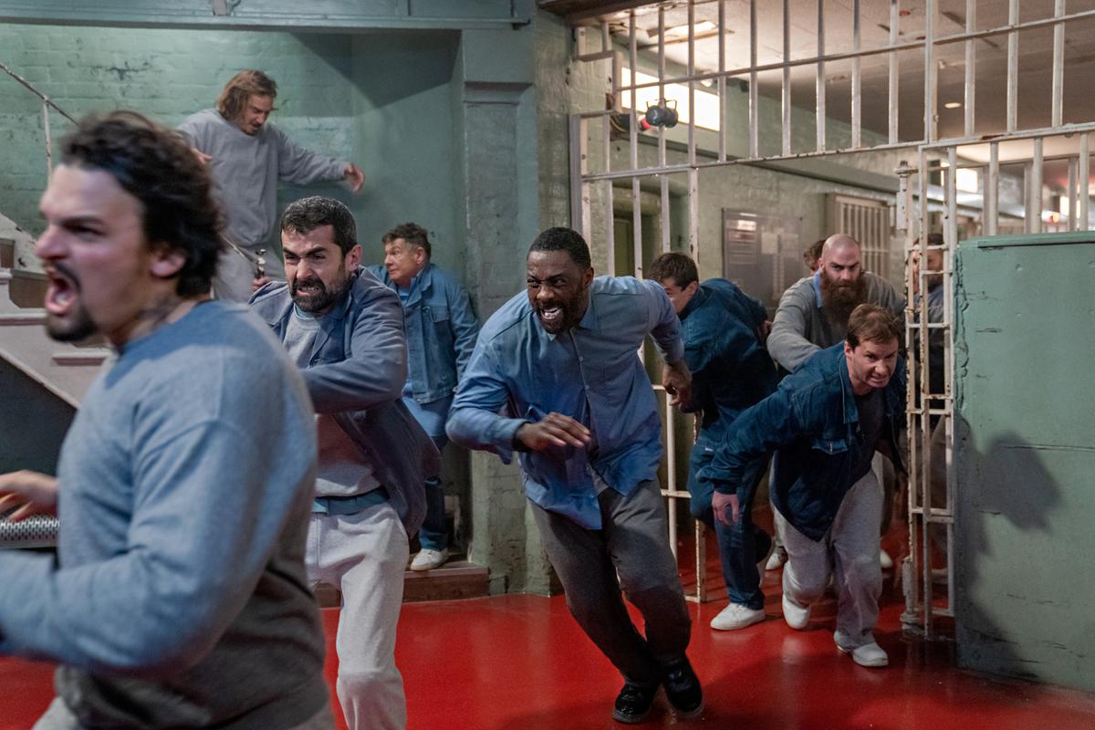 John Luther (Idris Elba, center) in the middle of a prison break, in "Luther: The Fallen Sun. "(John Wilson/Netflix)