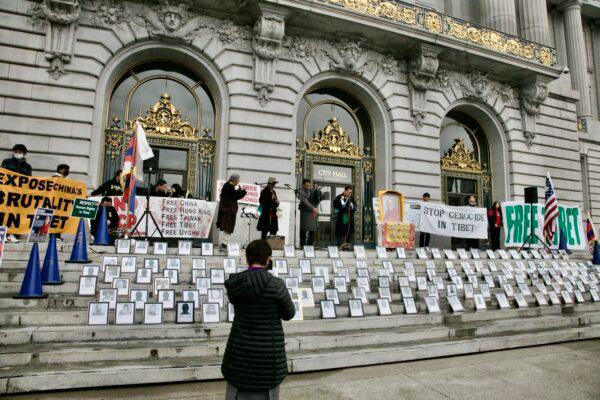 Photographs of people who performed self-immolations in protest of the Chinese Communist Party’s persecution of Tibetans, displayed on the steps of City Hall in San Francisco on March 10, 2023. (Xue Mingzhu/The Epoch Times)