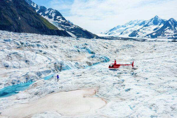 Helicopter tours offer visitors breathtaking views of Alaska’sstunning glaciers and mountains from above. (Travel Alaska)