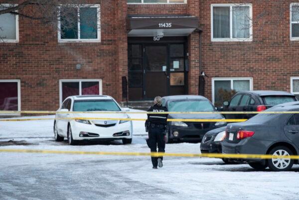 Police investigate the scene where two officers were shot and killed on duty in Edmonton on March 16, 2023. (Jason Franson /The Canadian Press via AP)