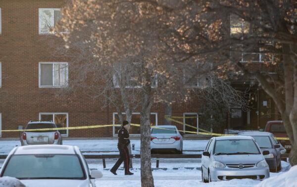 Police investigate the scene where two officers were shot and killed on duty in Edmonton on March 16, 2023. (Jason Franson/The Canadian Press via AP)