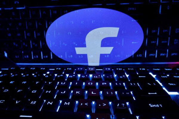 A keyboard is placed in front of a displayed Facebook logo in an illustration taken on Feb. 21, 2023. (Dado Ruvic/Illustration/Reuters)