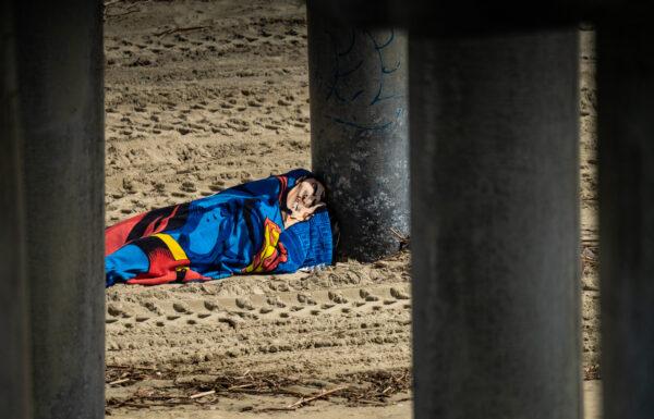 A homeless man in Huntington Beach, Calif., on March 17, 2023. (John Fredricks/The Epoch Times)