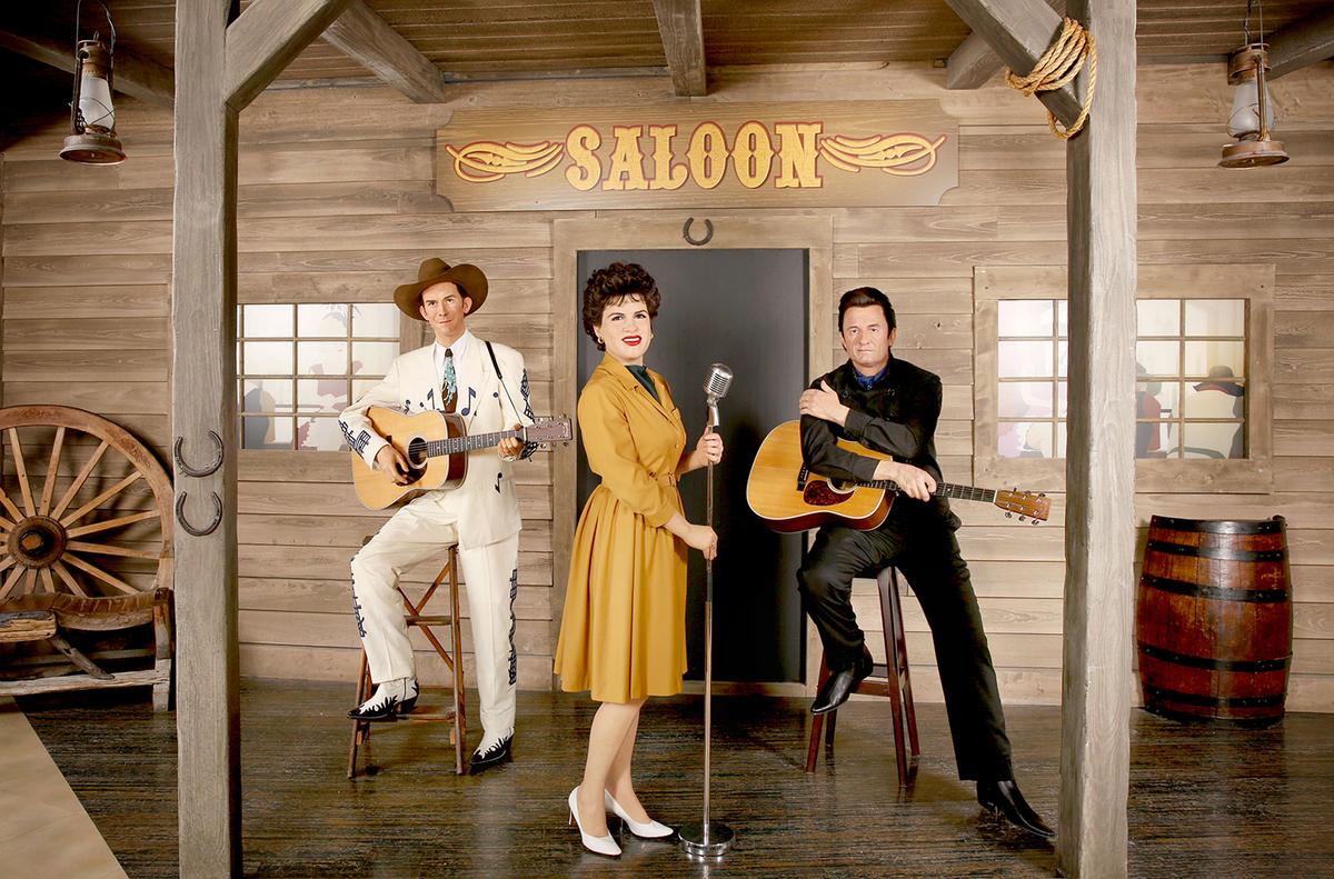 Madame Tussauds Hollywood set with country music legends (L) Hank Williams Sr., Patsy Cline, and Johnny Cash. (Rachel Murray/Getty Images)
