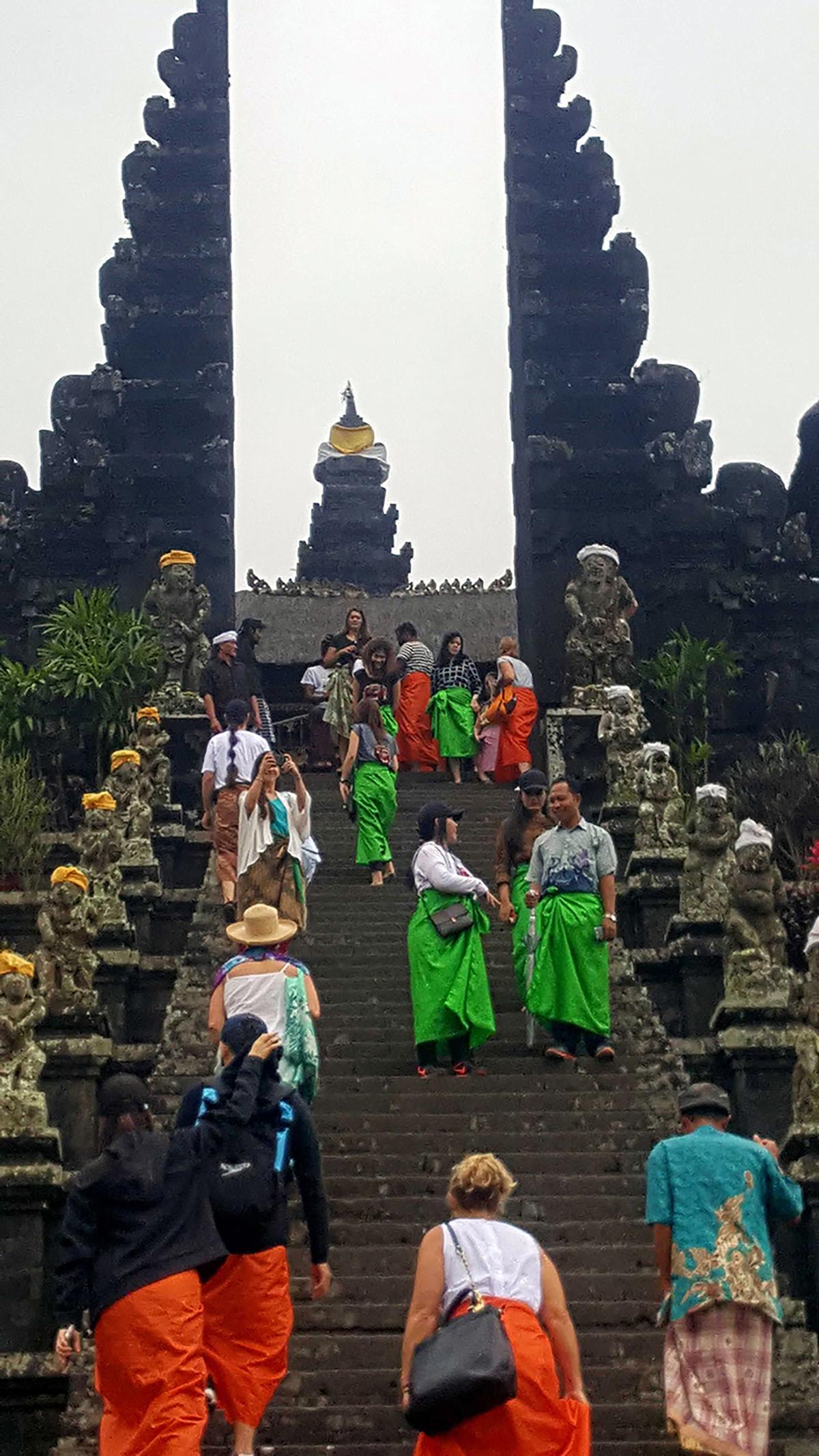 To visit a temple in Bali, Indonesia, our group was given sarongs to wrap around our bare legs as a show of respect. This trip was booked through Best Single Travel. (Nancy Clanton/The Atlanta Journal-Constitution/TNS)