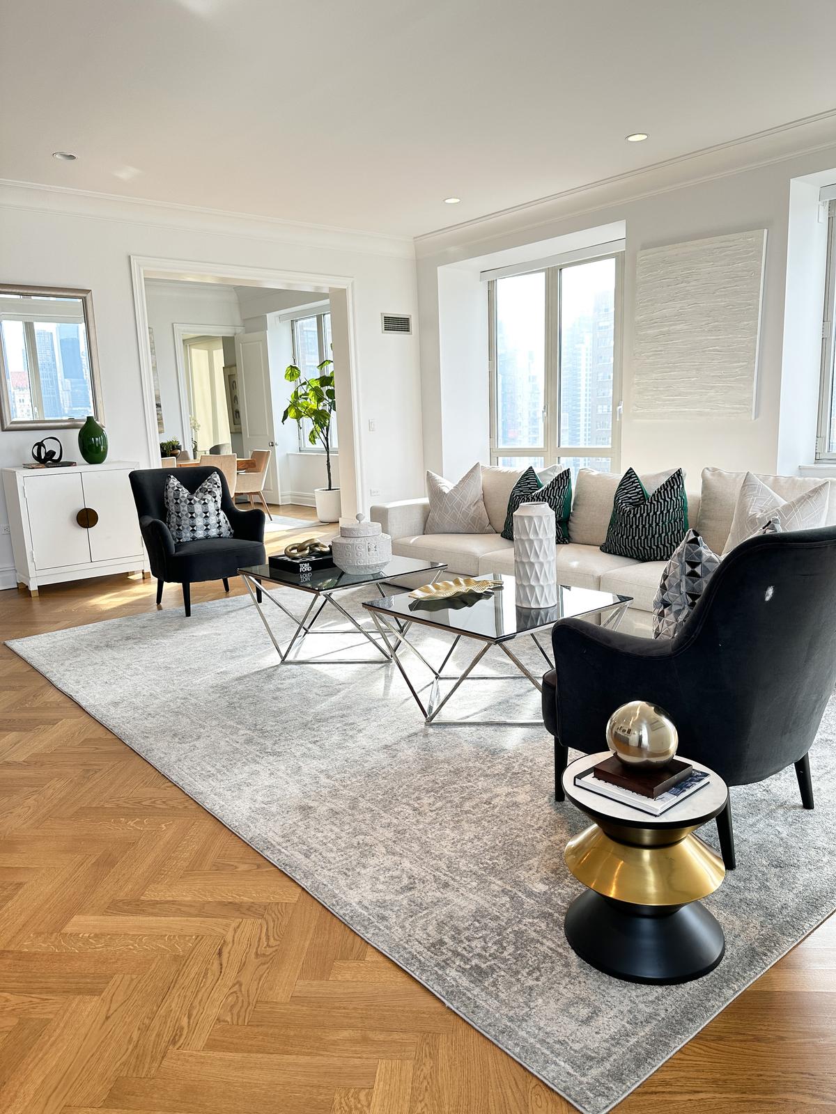 Elements of black, white, and gold are repeated throughout this living room to create a sense of cohesion. (Provided photo/TNS)
