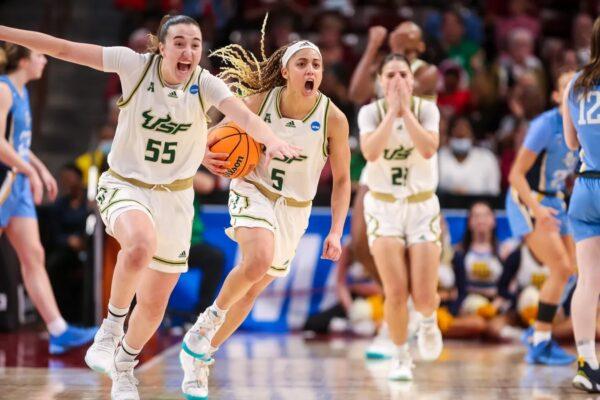 South Florida Bulls guard Carla Brito (55) and guard Elena Tsineke (5) celebrate their win over the Marquette Golden Eagles in the first round of the 2023 NCAA Division 1 women s basketball tournament at Colonial Life Arena in Columbia, S.C., on March 17, 2023. (Jeff Blake-USA TODAY Sports via Field Level Media)