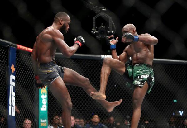 Leon Edwards (L) in action against Kamaru Usman during their welterweight title bout during UFC 286 mixed martial arts event at O2 Arena in London on March 18, 2023. (Kieran Cleeves/PA via AP)