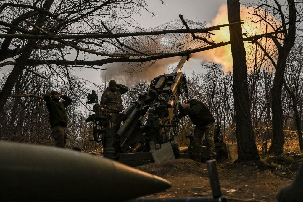Ukrainian servicemen fire a M777 howitzer at Russian positions near Bakhmut, eastern Ukraine, on March 17, 2023, amid the Russian invasion of Ukraine. (Aris Messinis/AFP via Getty Images)