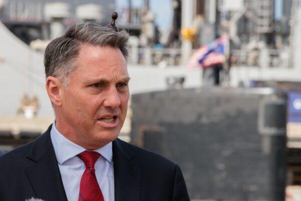 Defence Minister Richard Marles speaks at a press conference in front of the USS Asheville, a Los Angeles-class nuclear powered fast attack submarine during a tour of HMAS Stirling in Perth, Australia, on March 16, 2023. (AAP Image/Richard Wainwright)