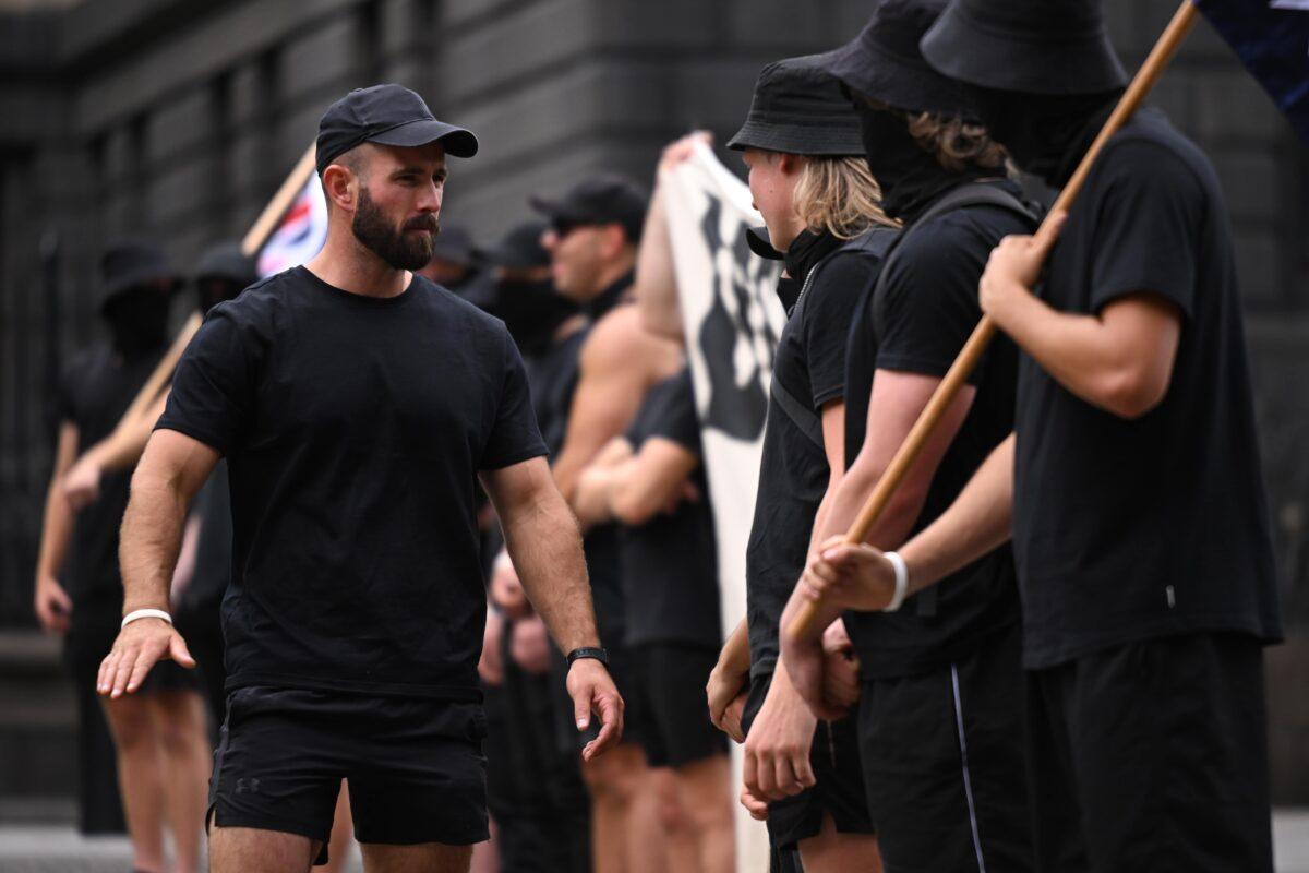 The group of Nazi supporters disrupting the Let Women Speak rally is seen in Melbourne, Australia, on March 18, 2023. (James Ross/AAP Image)