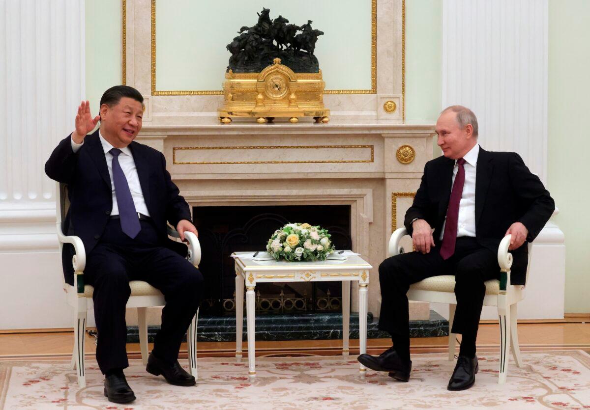 Chinese President Xi Jinping gestures while speaking to Russian President Vladimir Putin during their meeting at the Kremlin in Moscow on March 20, 2023. (Sergei Karpukhin, Sputnik, Kremlin Pool Photo via AP)