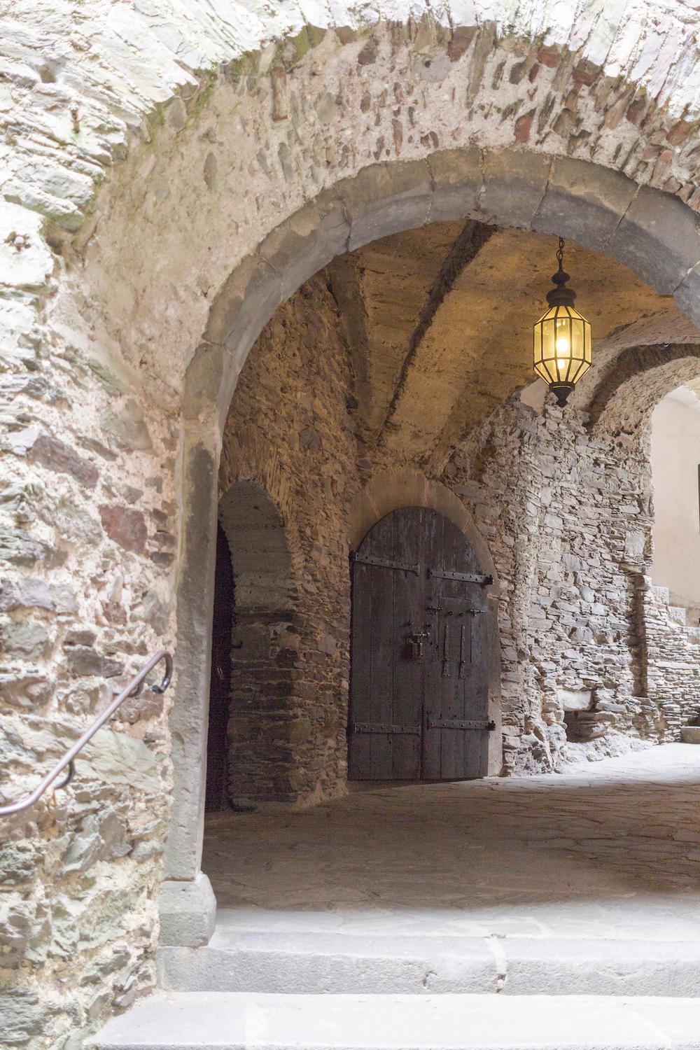 An antique medieval stone arch inside the castle (Titolino/Shutterstock)