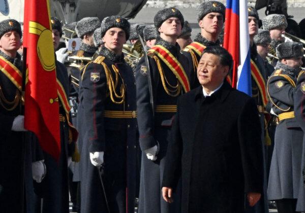 Chinese leader Xi Jinping walks past honour guards during a welcoming ceremony at Moscow's Vnukovo airport on March 20, 2023. (Anatoliy Zhdanov/Kommersant Photo/AFP via Getty Images)