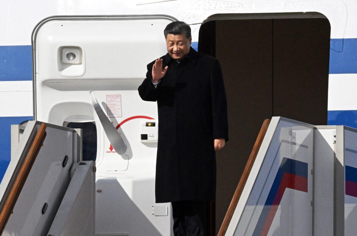 China's President Xi Jinping waves as he disembarks off his aircraft upon arrival at Moscow's Vnukovo airport on March 20, 2023. (Anatoliy Zhdanov/Kommersant /AFP via Getty Images)
