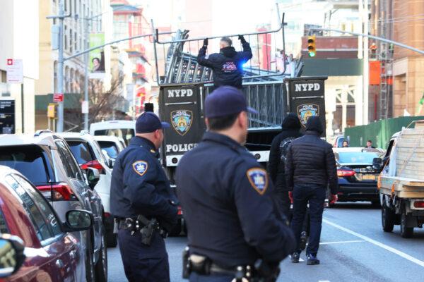 New York Court officers watch as NYPD drop off metal barricades in front of the Manhattan Criminal Court in N.Y.C., on March 20, 2023. (Michael M. Santiago/Getty Images)