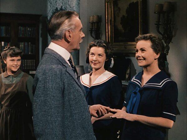 Frank Gilbreth (Clifton Webb, L) performing one of his in-home inspections as daughter Anne (Jeanne Crain) cheerily looks on, in “Cheaper by the Dozen.” (20th Century Fox)