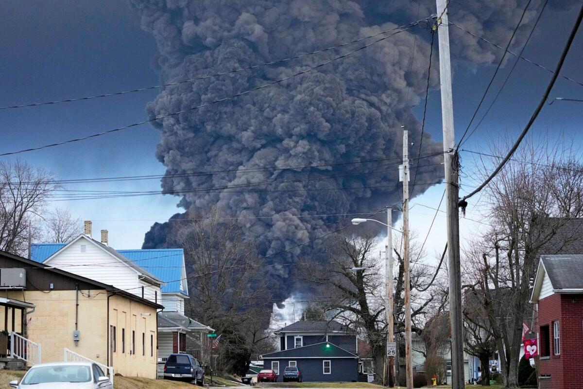 A black plume rises over East Palestine, Ohio, as a result of a controlled detonation of a portion of the derailed Norfolk Southern trains, Feb. 6, 2023. (Gene J. Puskar/AP Photo/File)