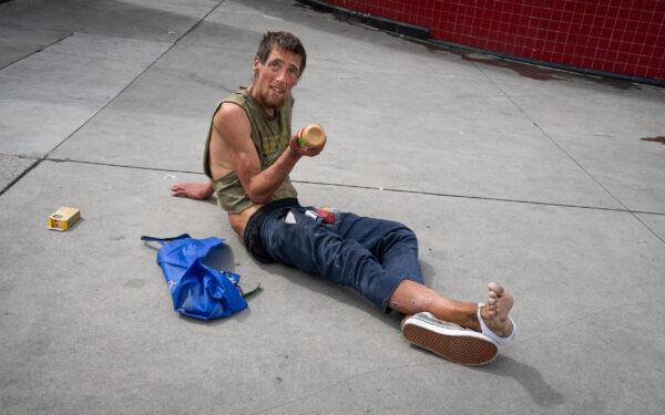 A homeless man in LA Metro's Westlake/MacArthur Park station in Los Angeles on March 20, 2023. (John Fredricks/The Epoch Times)