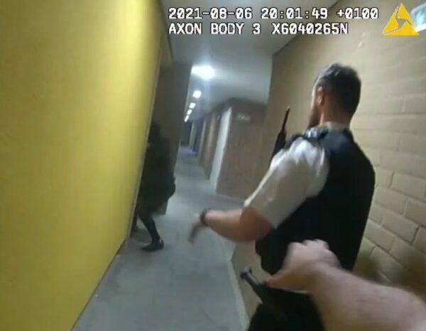 A still from body-worn camera footage of Sulai Man being chased by police officers after he stabbed a social worker in a block of flats in Wood Green, north London, on Aug. 6, 2021. (Metropolitan Police)