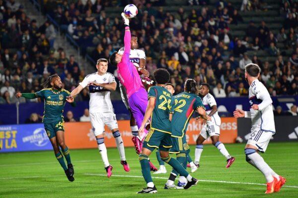 Los Angeles Galaxy goalkeeper Jonathan Bond (1) deflects a cross from the Vancouver Whitecaps during the first half at Dignity Health Sports Park in Los Angeles on Mar. 18, 2023. (Gary A. Vasquez/USA TODAY Sports via Field Level Sports)