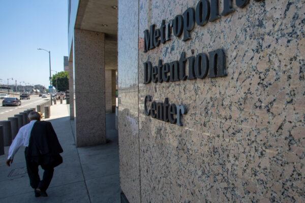 A pedestrian passes the Metropolitan Detention Center prison in Los Angeles, on July 14, 2019. (David McNew/Getty Images)