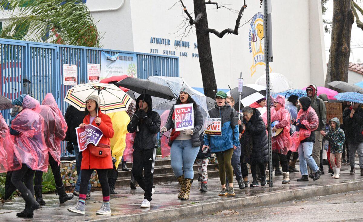 Los Angeles public school support workers, teachers, and supporters walk the picket line in front of an elementary school in Los Angeles on March 21, 2023. (Robyn Beck/AFP via Getty Images)