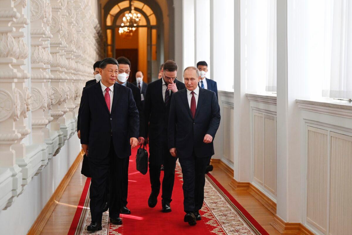 Russian President Vladimir Putin and Chinese leader Xi Jinping walk prior to their talks at The Grand Kremlin Palace in the Kremlin on March 21, 2023. (Grigory Sysoyev, Sputnik, Kremlin Pool Photo via AP)
