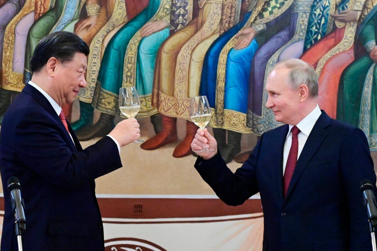 Russian President Vladimir Putin, right, and Chinese leader Xi Jinping toast during their dinner at The Palace of the Facets is a building in the Moscow Kremlin, Russia, on March 21, 2023. (Pavel Byrkin, Sputnik, Kremlin Pool Photo via AP)