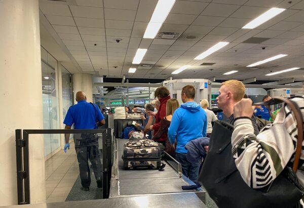 People waiting in line to go through Orlando International Airport MCO TSA security on a busy day. (Courtesy of Ed Perkins)