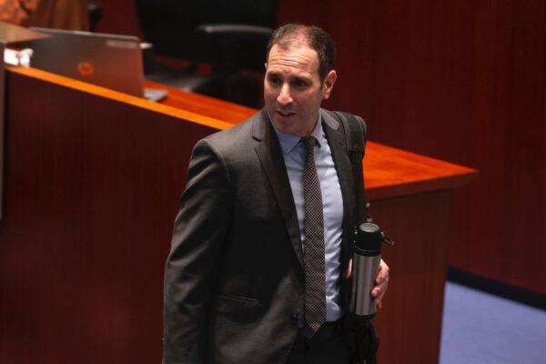 Councillor Josh Matlow enters the council chamber in Toronto ahead of a Budget meeting on February 15, 2023. (The Canadian Press/Chris Young)