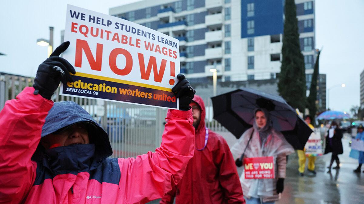 Los Angeles Unified School District (LAUSD) workers and supporters picket outside Robert F. Kennedy Community Schools on the first day of a strike over a new contract in Los Angeles on March 21, 2023. (Mario Tama/Getty Images)