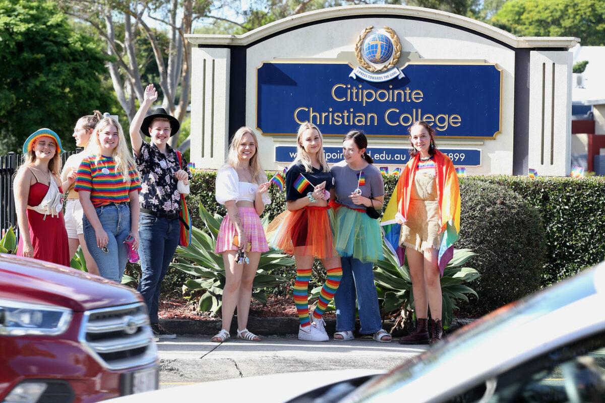LGBTQI supporters stand outside Citipointe Christian College in Brisbane, Australia, on Jan. 31, 2022. (Jono Searle/AAP Image)