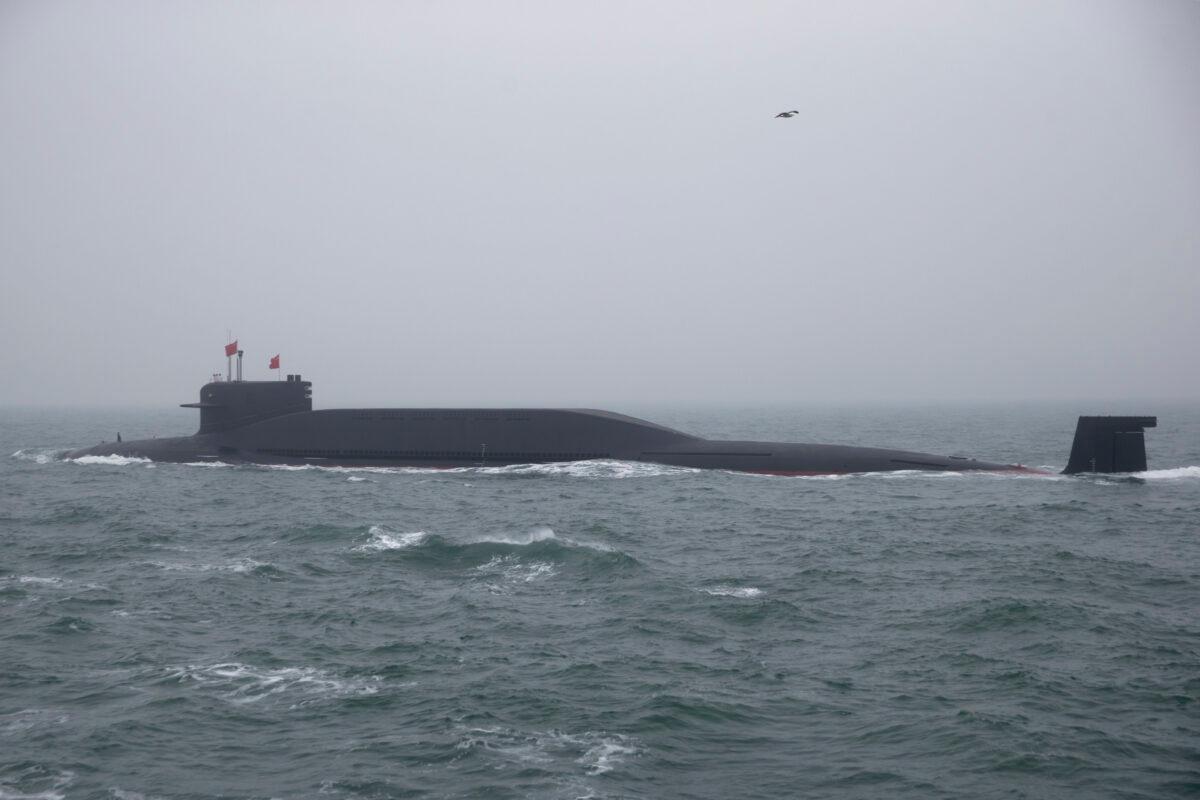 A type 094 Jin-class nuclear submarine Long March 15 of the Chinese People's Liberation Army Navy participates in a naval parade to commemorate the 70th anniversary of the founding of China's navy in the sea near Qingdao, Shandong Province, China, on April 23, 2019. (Mark Schiefelbein/AFP via Getty Images)