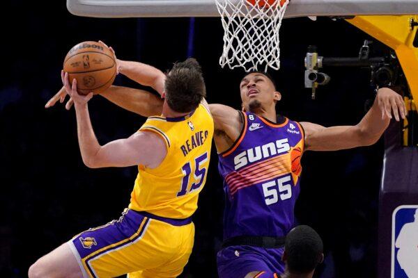 Los Angeles Lakers guard Austin Reaves (L), shoots as Phoenix Suns forward Darius Bazley defends during the first half of an NBA basketball game in Los Angeles on March 22, 2023. (Mark J. Terrill/AP Photo)